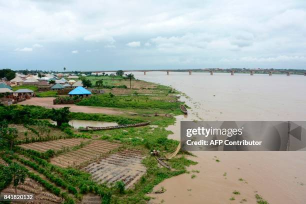 The Benue river overflows following heavy rains, in Makurdi, Benue State, Nigeria, on September 1, 2017. At least one person has been killed after...