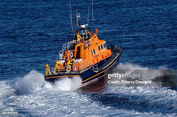 life boat in training in north sea - liferaft stock pictures, royalty-free photos & images