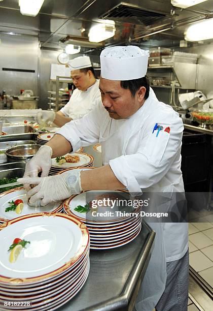 filippino cook preparing entree - cruise ship kitchen stock pictures, royalty-free photos & images