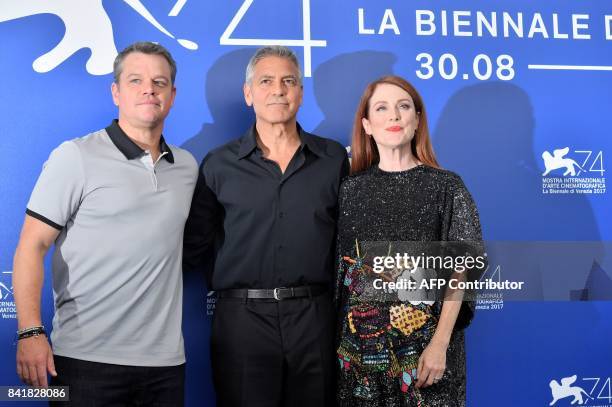 Actor Matt Damon , US actor and director George Clooney and US actess Julianne Moore attend the photocall of the movie "Suburbicon" presented out of...