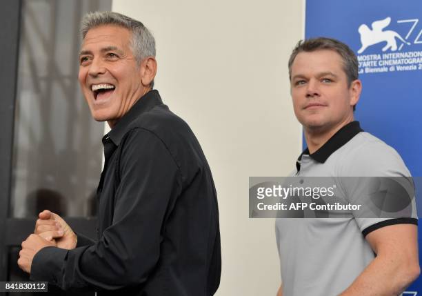 Actor Matt Damon and director George Clooney attend the photocall of the movie "Suburbicon" presented out of competition at the 74th Venice Film...