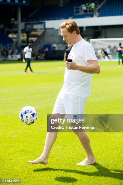 Damian Lewis warms up during the #GAME4GRENFELL at Loftus Road on September 2, 2017 in London, England. The charity football match has been set up to...