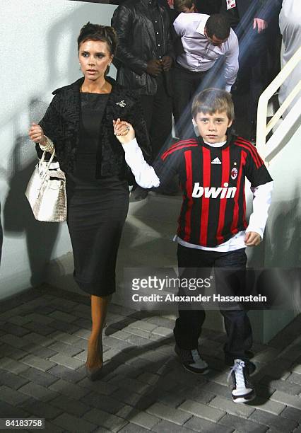 Victoria Beckham and her son Brooklyn seen during the Dubai Football Challenge match between AC Milan and Hamburger SV at the Emirates Sevens Stadium...