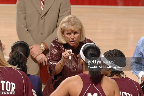 Sharon Fanning, head coach of the Mississippi State Bulldogs, talks to the team at the bench during a college basketball game against the Marshall...