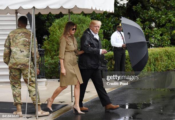 President Donald Trump walks with first lady Melania Trump prior to their Marine One departure from the White House September 2, 2017 in Washington,...