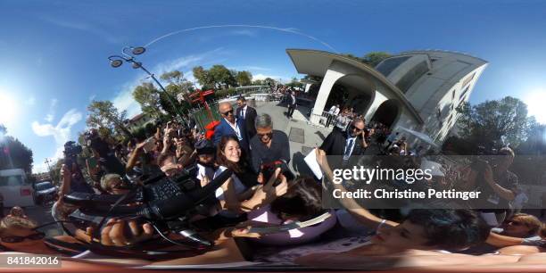 George Clooney signs autographs while arriving to the photocall of 'Suburbicon' during the 74th Venice Film Festival on September 2, 2017 in Venice,...