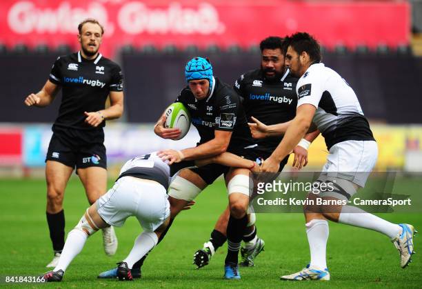 Ospreys' Justin Tipuric is tackled by Zebre's Marcello Violi during the Guinness Pro14 match between Ospreys and Zebre at Liberty Stadium on...
