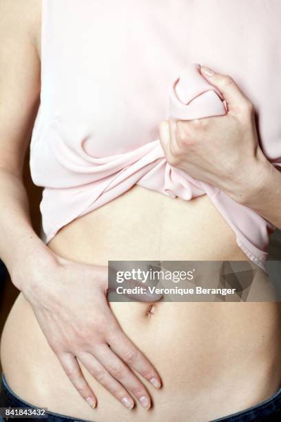 woman showing her flat stomach. - animal abdomen stock pictures, royalty-free photos & images