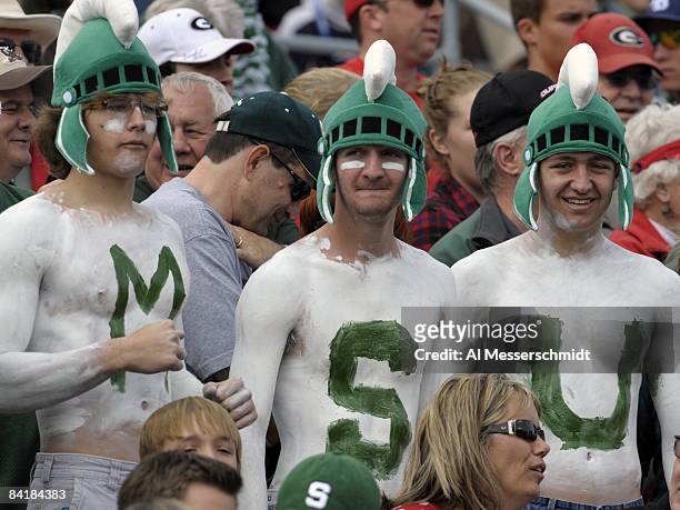 Fans of the Michigan State Spartans cheer play against the Georgia Bulldogs at the 2009 Capital One Bowl at the Citrus Bowl on January 1, 2009 in...