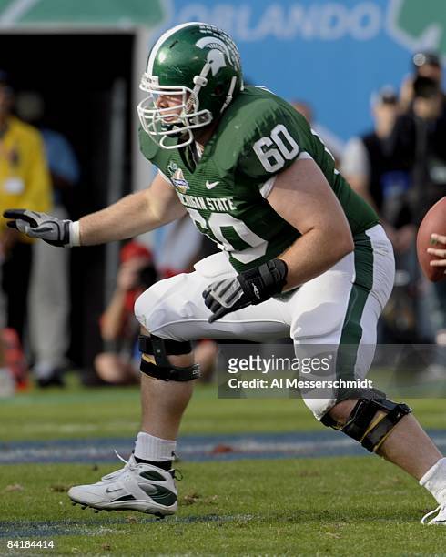 Offensive lineman Mike Bacon of the Michigan State Spartans sets to block against the Georgia Bulldogs at the 2009 Capital One Bowl at the Citrus...