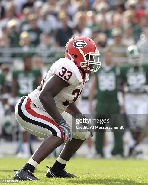 Linebacker Dannell Ellerbe of the University of Georgia sets on defense against the Michigan State Spartans at the 2009 Capital One Bowl at the...