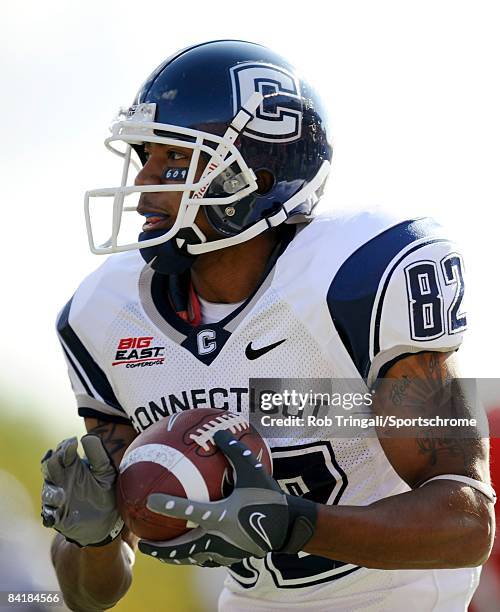 Wide receiver Kashif Moore of the Connecticut Huskies runs with the ball against the Rutgers Scarlet Knights at Rutgers Stadium on October 18, 2008...