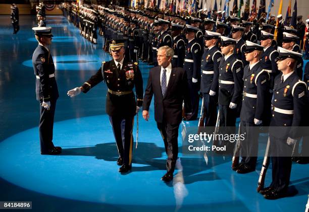 President George W. Bush turns after reviewing the troops during the Military Appreciation Parade at Fort Myer January 6, 2009 in Arlington,...