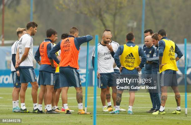 Jorge Sampaoli coach of Argentina gives instructions to his players during a training session at 'Julio Humberto Grondona' training camp on September...