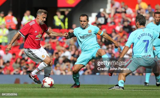 Karel Poborsky of Manchester United Legends in action with Sergi Barjuan of Barcelona Legends during the MU Foundation charity match between...