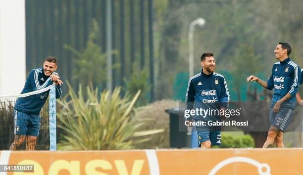 Mauro Icardi , Lionel Messi and Angel Di Maria smile during a training session at 'Julio Humberto Grondona' training camp on September 02, 2017 in...