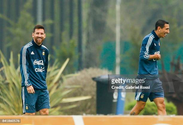 Lionel Messi and Angel Di Maria of Argentina smile during a training session at 'Julio Humberto Grondona' training camp on September 02, 2017 in...