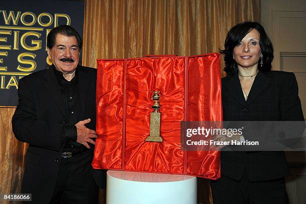 President of the Hollywood Foreign Association Jorge Canara and President of Dick Clark Productions Orly Adelson unveil the new 2009 Golden Globe...