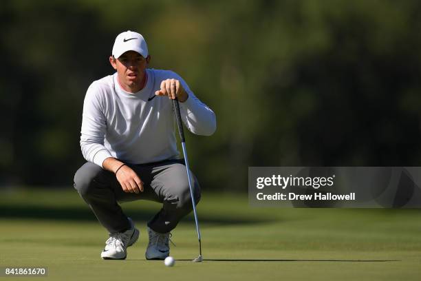 Rory McIlroy of Northern Ireland lines up a putt on the 13th green during round two of the Dell Technologies Championship at TPC Boston on September...