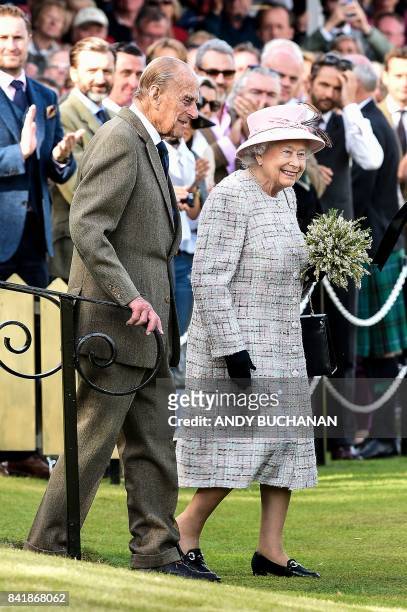 Britain's Queen Elizabeth II and Britain's Prince Philip, Duke of Edinburgh attend the annual Braemar Gathering in Braemar, central Scotland, on...