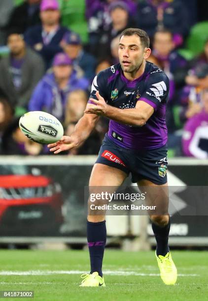 Cameron Smith of the Storm runs with the ball during the round 26 NRL match between the Melbourne Storm and the Canberra Raiders at AAMI Park on...