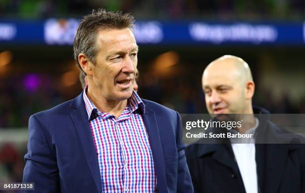 Storm coach Craig Bellamy and Todd Greenberg, Chief Executive Officer of the National Rugby League look on after the round 26 NRL match between the...