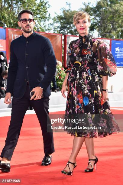 Riccardo Pasquale and Roberta Giarrusso walk the red carpet ahead of the 'Foxtrot' screening during the 74th Venice Film Festival at Sala Grande on...