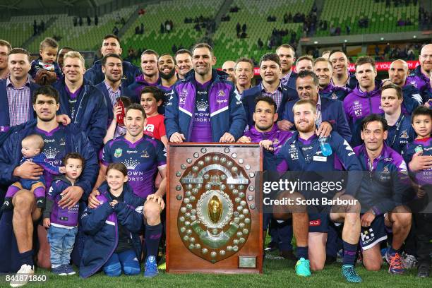 Cameron Smith and the Storm pose with the JJ Giltinan Shield as minor premiers after winning the round 26 NRL match between the Melbourne Storm and...