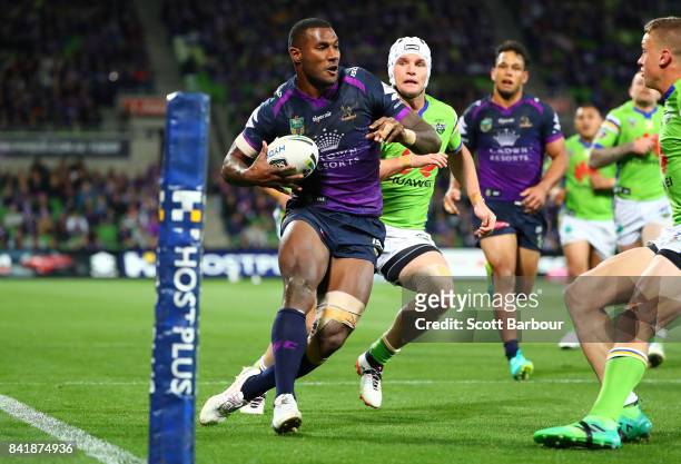 Suliasi Vunivalu of the Storm scores a try during the round 26 NRL match between the Melbourne Storm and the Canberra Raiders at AAMI Park on...