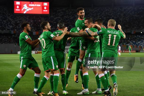 Ireland's Shane Duffy and his teammates celebrates scoring a goal during the 2018 FIFA World Cup group D qualifying football match between Georgia...
