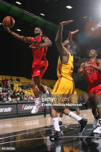 Jamaal Tatum of the Idaho Stampede swings a shot around Chris Hunter of the Fort Wayne Mad Ants during Day Two of the D-League Showcase at McKay...