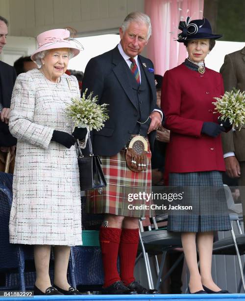 Queen Elizabeth II, Princess Anne, Princess Royal and Prince Charles, Prince of Wales watch the 2017 Braemar Gathering at The Princess Royal and Duke...