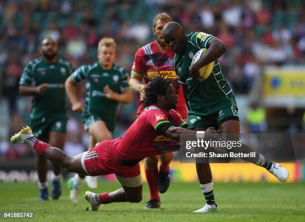 Topsy Ojo of London Irish is tackled by Marland Yarde of Harlequins during the Aviva Premiership match between London Irish and Harlequins at...
