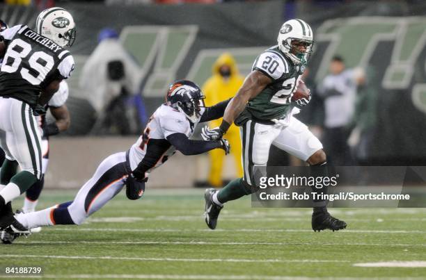 Running back Thomas Jones of the New York Jets rushes against the Denver Broncos on November 30, 2008 at Giants Stadium in East Rutherford, New...