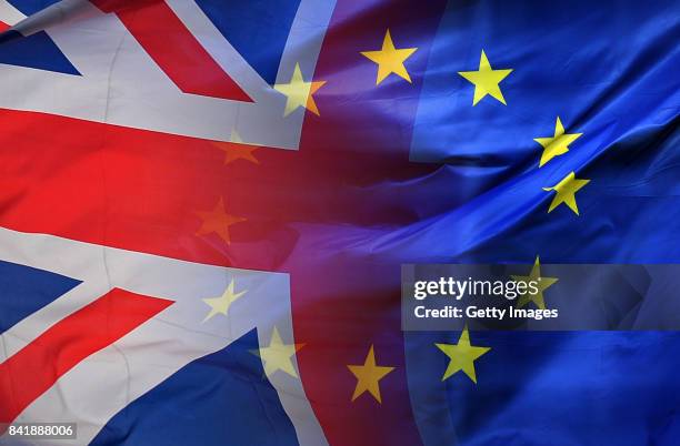 This composite photo illustration of images 650331660,651120206 shows the European Union Flag and United Kingdom Flag intertwined. BRUSSELS, BELGIUM...