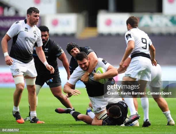 Zebre's David Sisi is tackled by Ospreys' James King during the Guinness Pro14 match between Ospreys and Zebre at Liberty Stadium on September 2,...