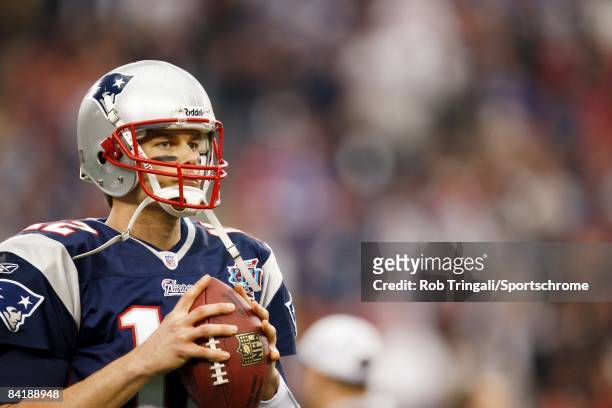 Quarterback Tom Brady of the New England Patriots looks on against the New York Giants during Super Bowl XLII on February 3, 2008 at University of...