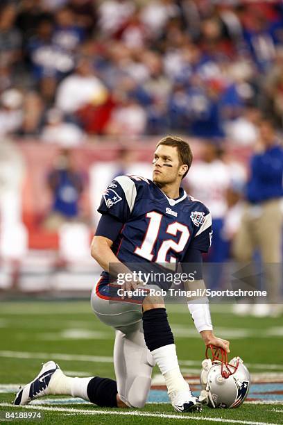 Quarterback Tom Brady of the New England Patriots looks on against the New York Giants during Super Bowl XLII on February 3, 2008 at University of...