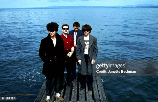 Echo and the Bunnymen standing near the water's edge, 1981. L to R: Ian McCulloch, Les Pattinson, Pete de Freitas, and Will Sergeant. Blackpool,...