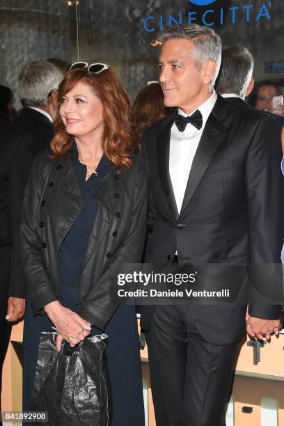 Susan Sarandon and George Clooney attend the 'Hollywood Foreign Press Association Cocktail Party' during the 74th Venice Film Festival on September...