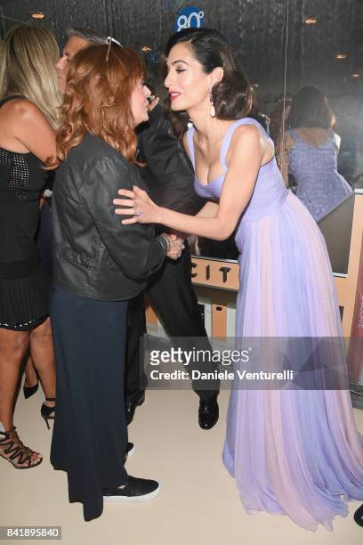 Susan Sarandon and Amal Clooney attend the 'Hollywood Foreign Press Association Cocktail Party' during the 74th Venice Film Festival on September 2,...