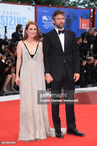 Bart Freundlich and Julianne Moore walk the red carpet ahead of the 'Suburbicon' screening during the 74th Venice Film Festival at Sala Grande on...