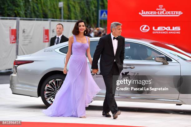 George Clooney and Amal Clooney walk the red carpet ahead of the 'Suburbicon' screening during the 74th Venice Film Festival at Sala Grande on...