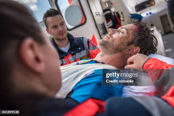 paramedic team pushing stretcher - serious injury stock pictures, royalty-free photos & images