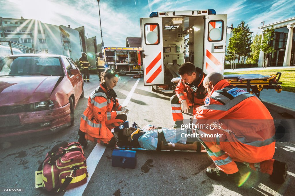 Paramedics providing first aid