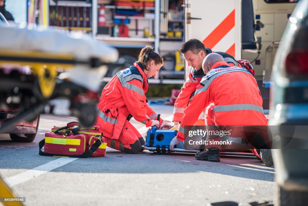 Paramedics providing first aid