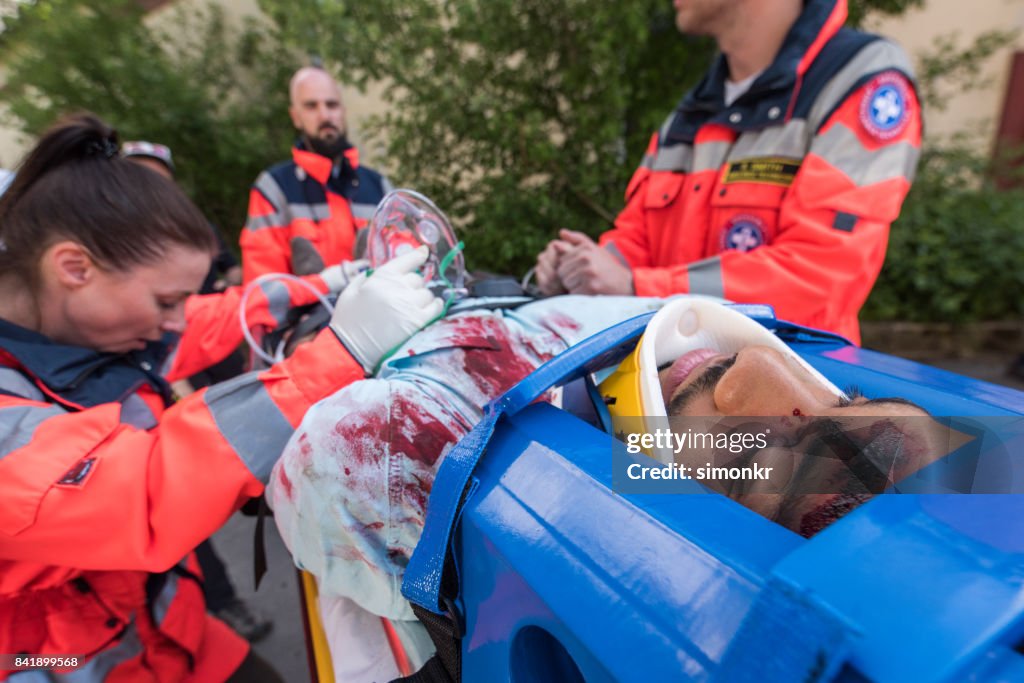 Paramedics providing first aid