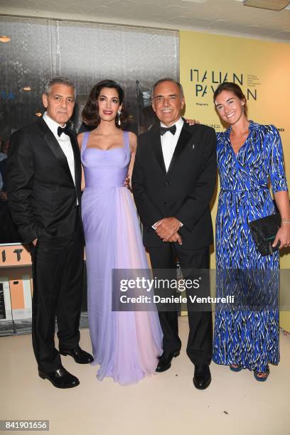 George Clooney, Amal Clooney, Alberto Barbera and Giulia Rosmarino attends the 'Hollywood Foreign Press Association Cocktail Party' during the 74th...