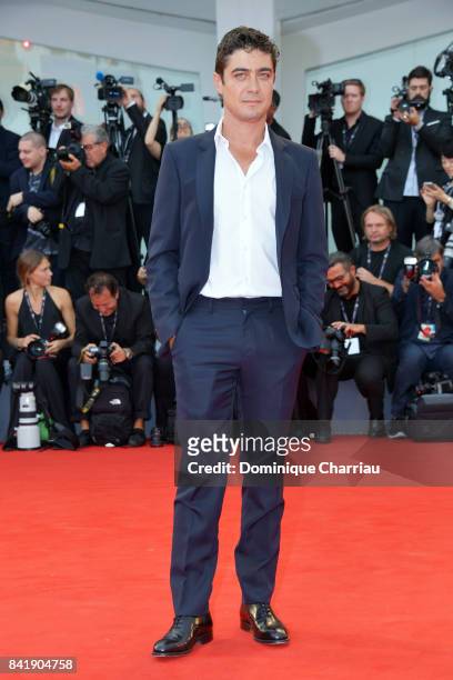 Riccardo Scamarcio walks the red carpet ahead of the 'Suburbicon' screening during the 74th Venice Film Festival at Sala Grande on September 2, 2017...