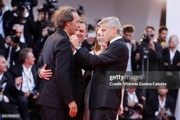 Alexander Desplat, Matt Damon, Julianne Moore and George Clooney walk the red carpet ahead of the 'Suburbicon' screening during the 74th Venice Film...